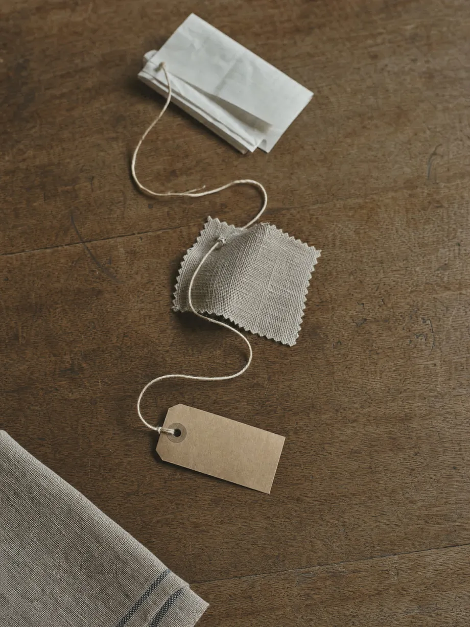 A single unbroken length of twine connecting several everyday objects on a table.